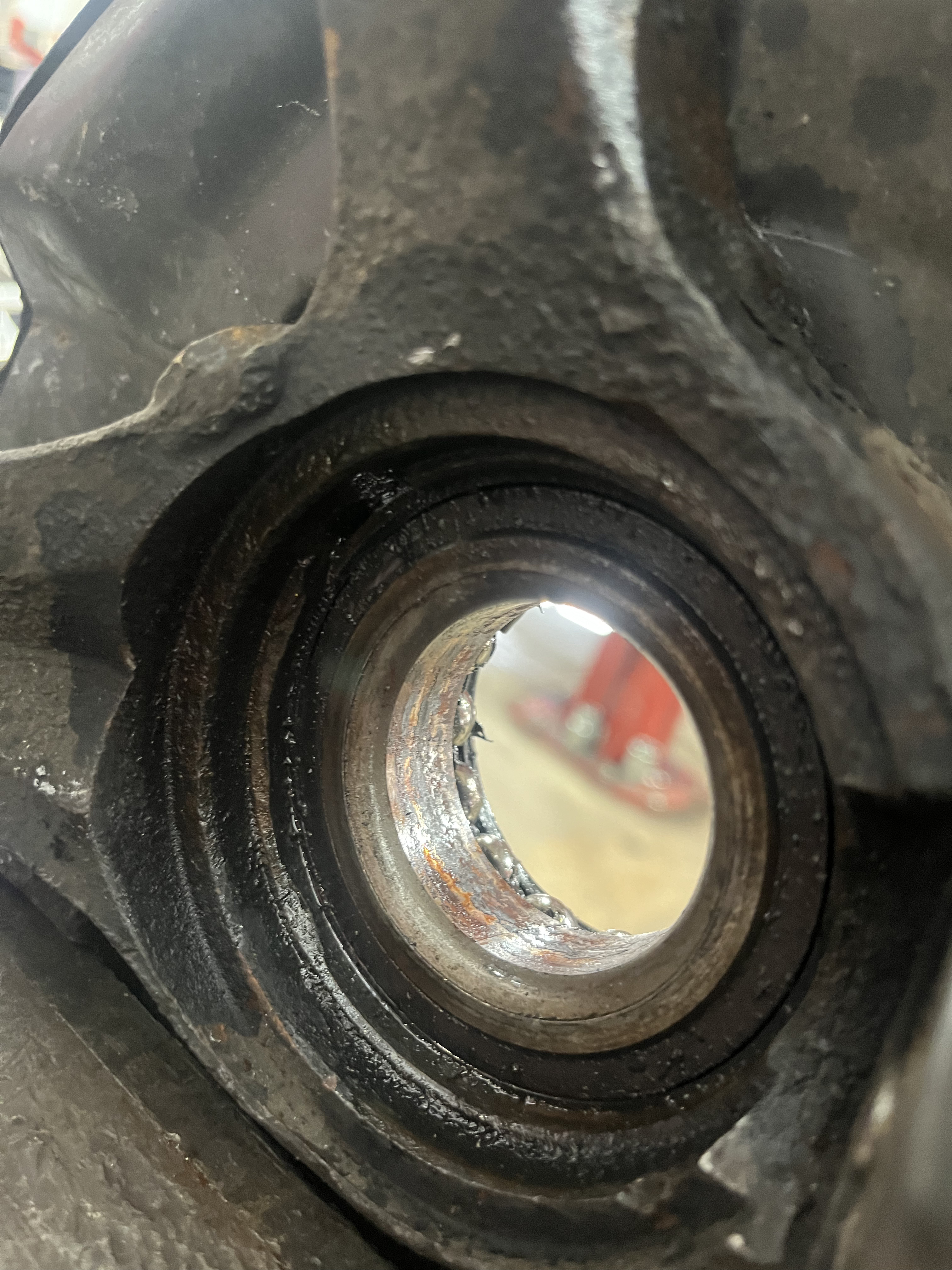 Spindle bore of Honda Accord knuckle inspected for damage from failed bearing
